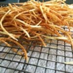 crispy potato strings on rack