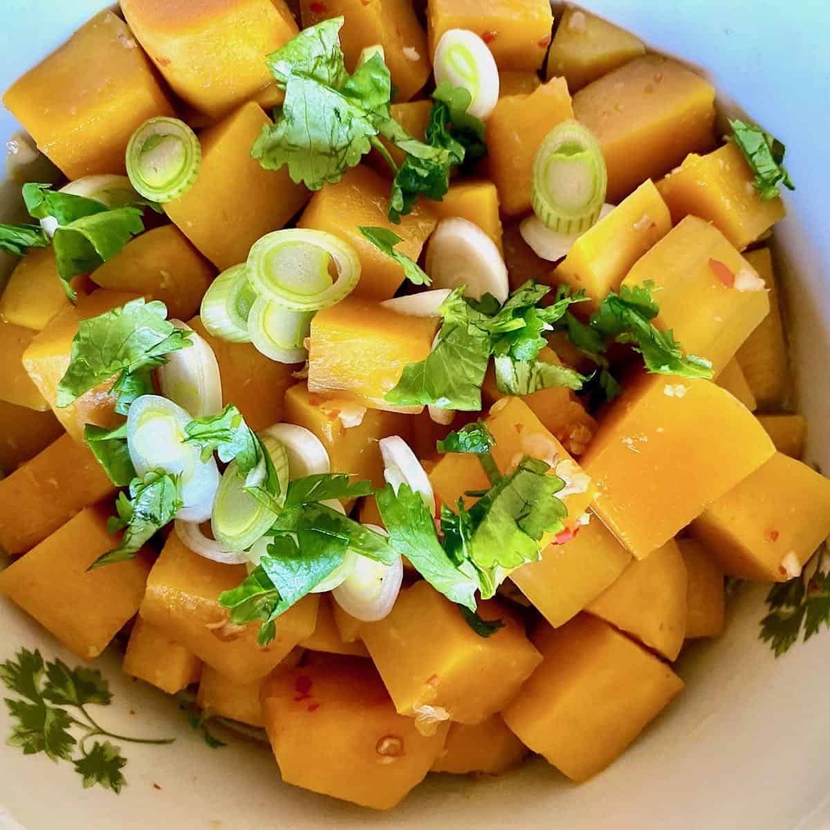 Sous vide butternut squash with green onions and cilantro.