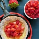 strawberry kropsua in a cast iron pan with fresh strawberries