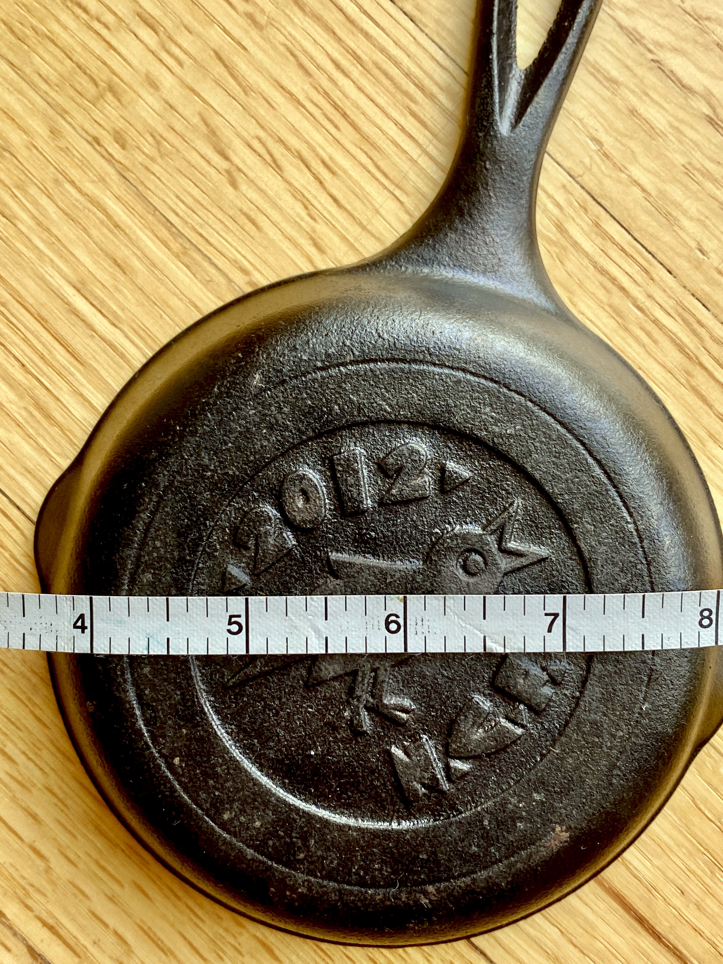 4 inch cast iron pan with measuring tape