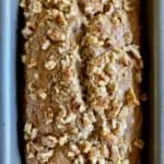 loaf of banana bread topped with nuts