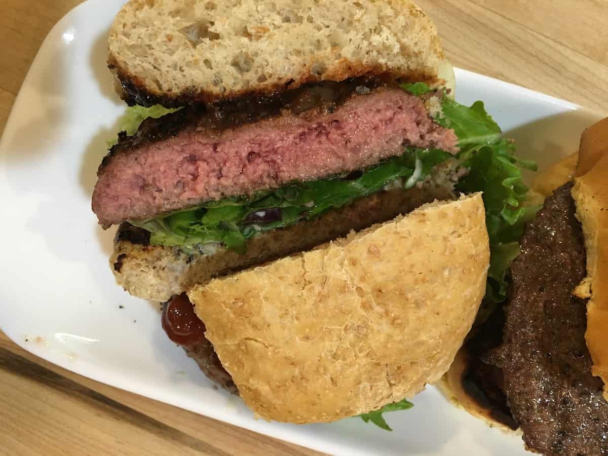 Hamburger sliced in half.
