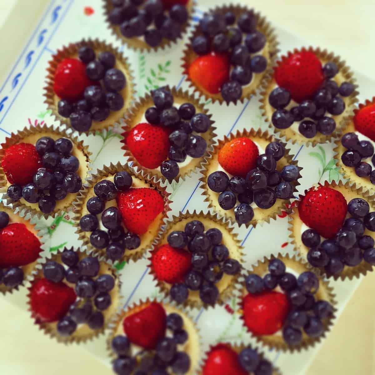 Berry topped mini cheesecakes.