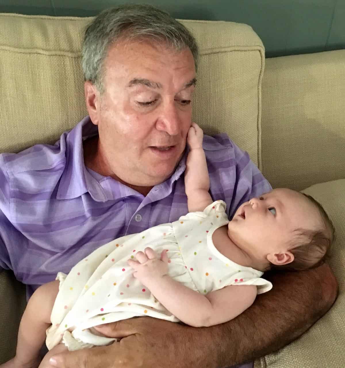 My brother holding my grand daughter.