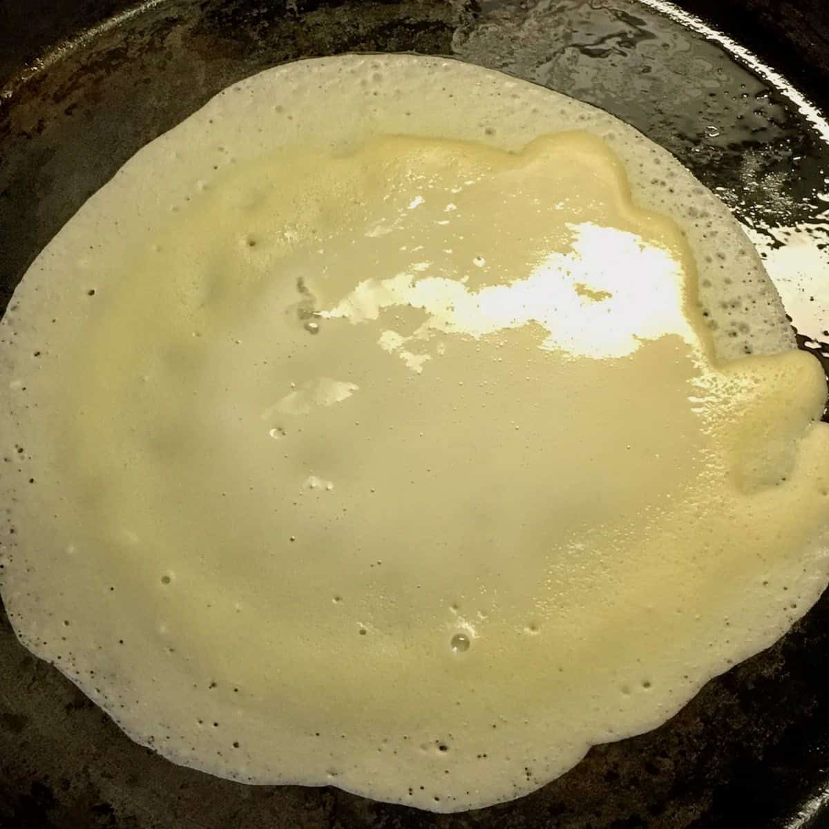 Cooking a crepe.