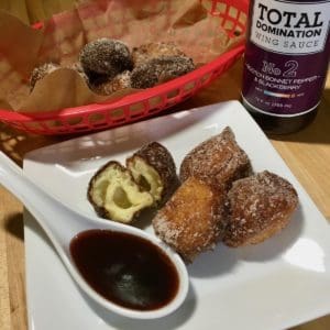 Hot wing donuts or Ricotta Puffs or Fritters with scotch bonnet blackberry hot sauce.