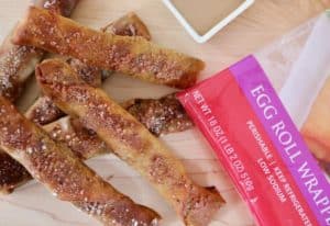stuffed egg roll soft pretzels with product wrapper and caramel dip