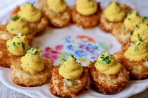 Plate of crispy coconut curried devils eggs.