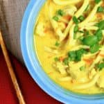 bowl of mulligatawny noodle soup with chop sticks
