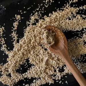 Quinoa with wooden spoon.