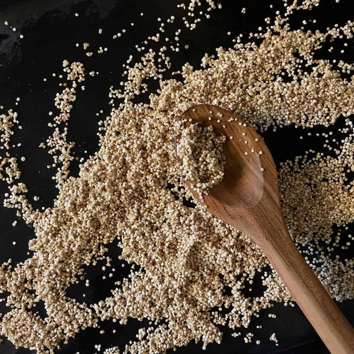 Quinoa with wooden spoon.