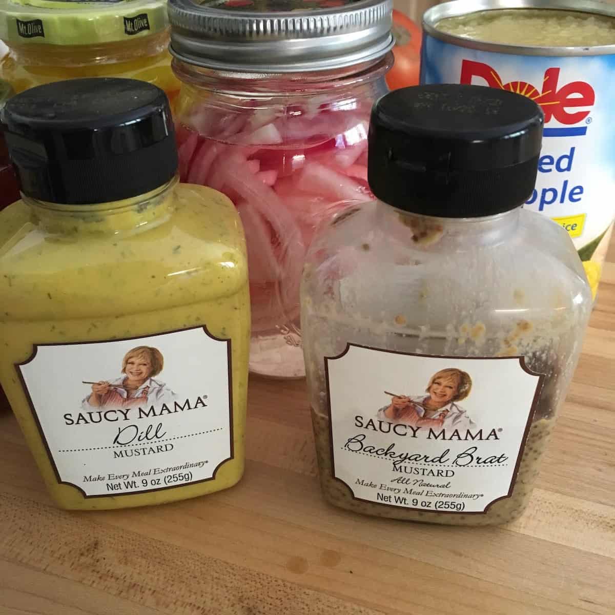 Saucy mama mustard jars, pickled onions and pineapple.