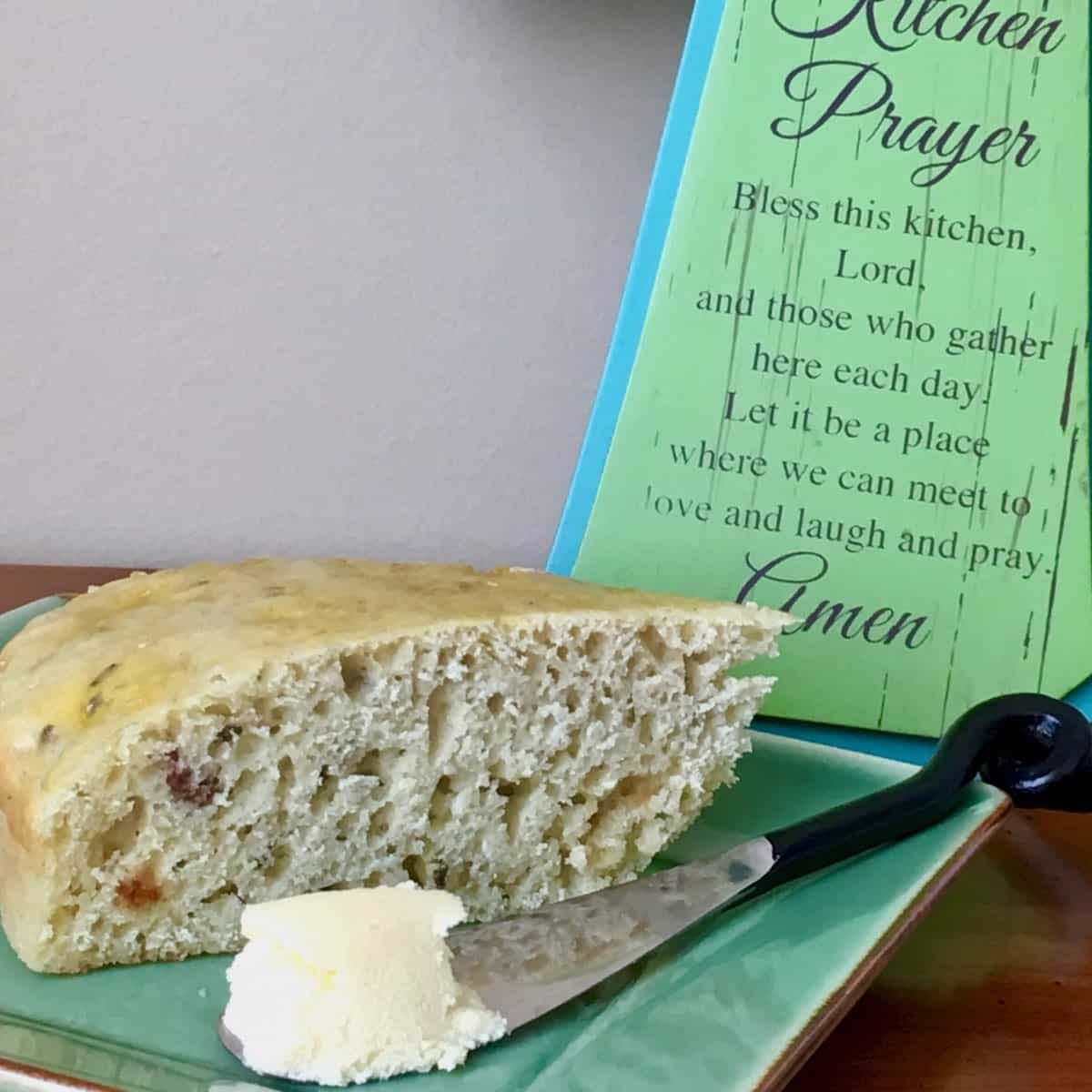 Kitchen prayer and plate of sliced Irish soda bread and butter.