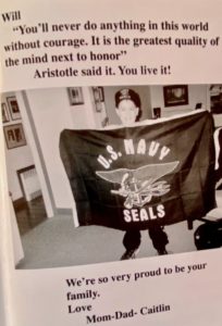 Will holding Navy SEAL sign