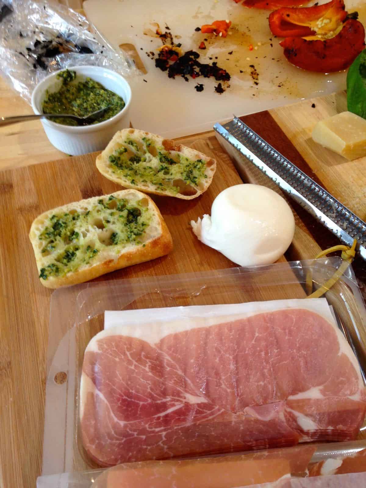 Fresh pesto, mozzarella, proscuitto and roasted red peppers.
