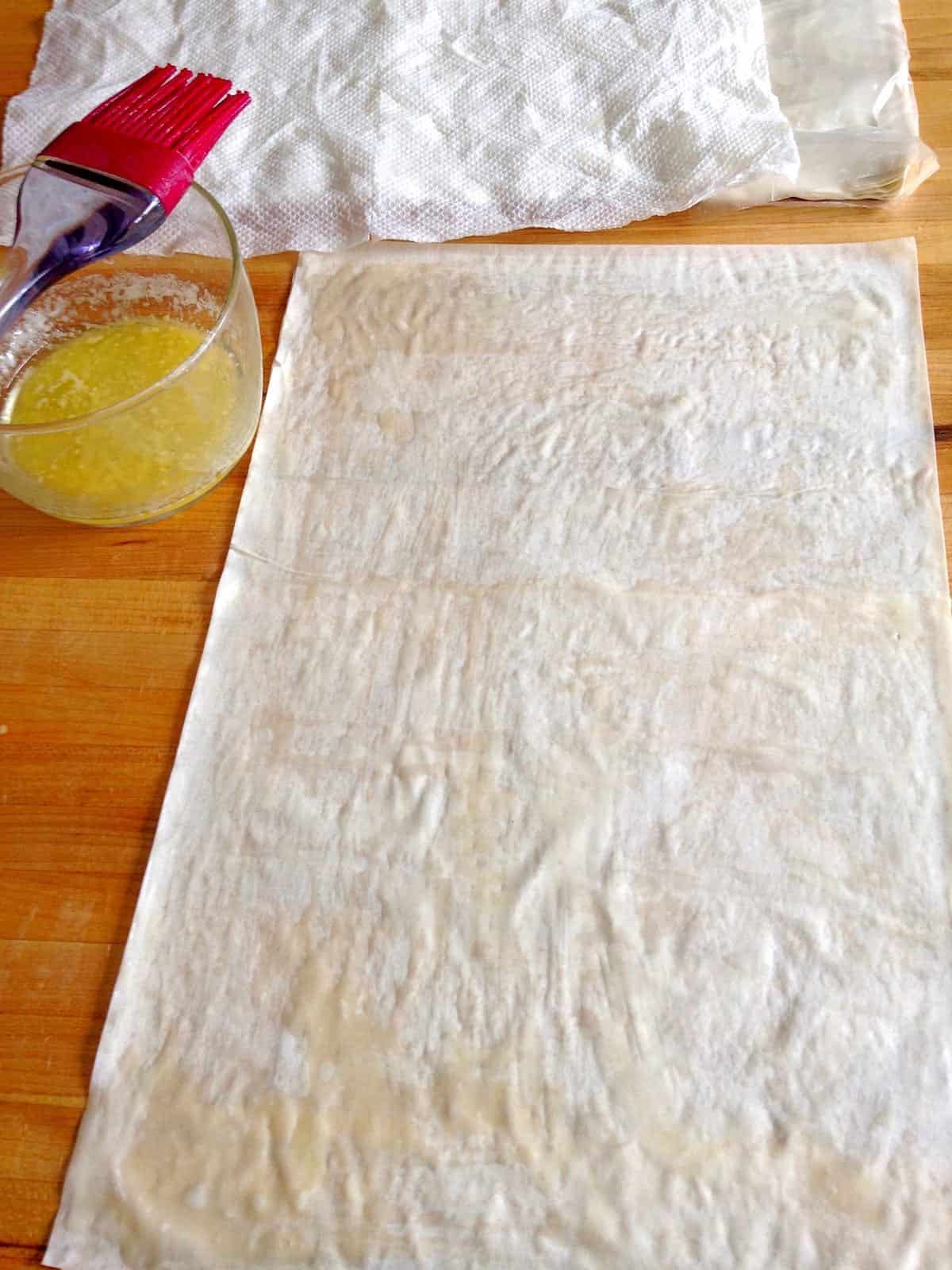 Phyllo dough and melted butter.