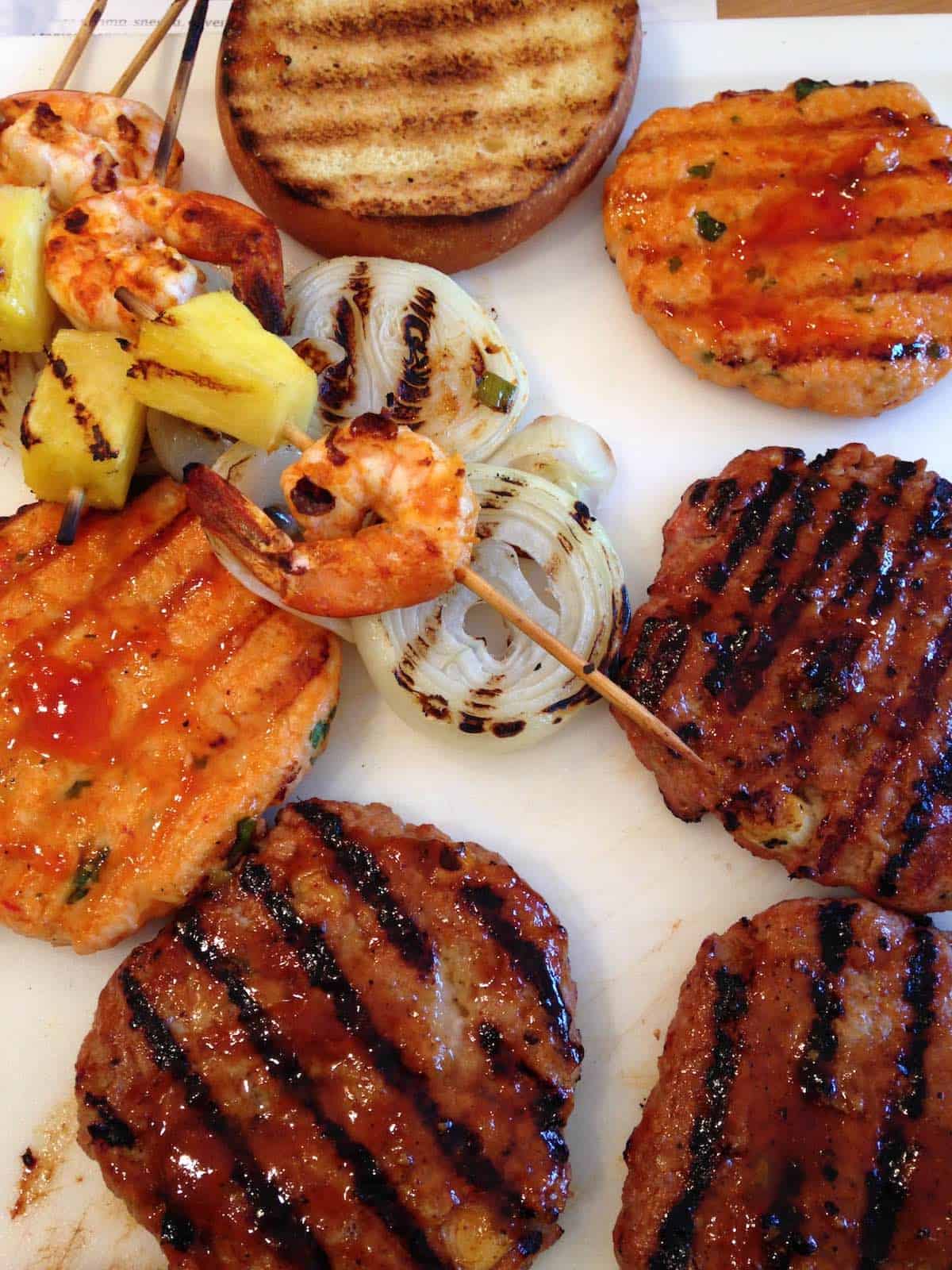 Glazed burgers and shrimp, onions, pineapple.