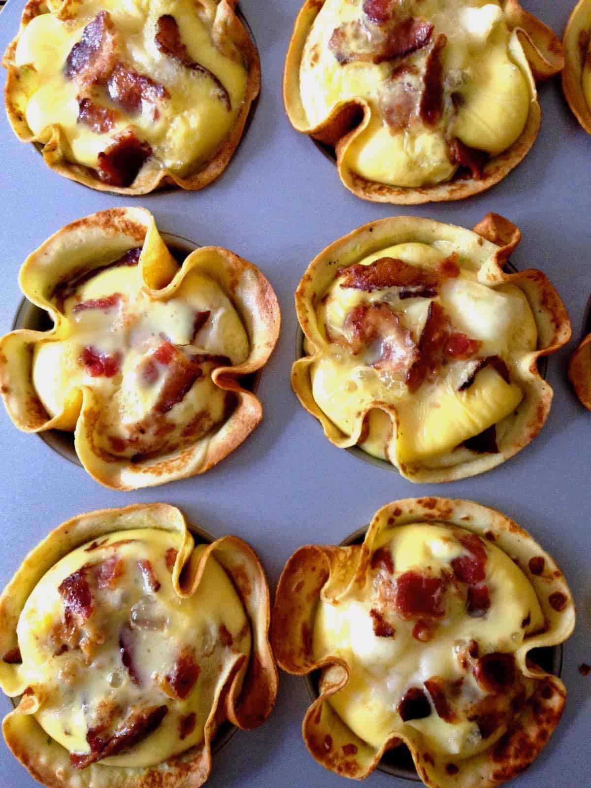 Baked egg crepe cups.