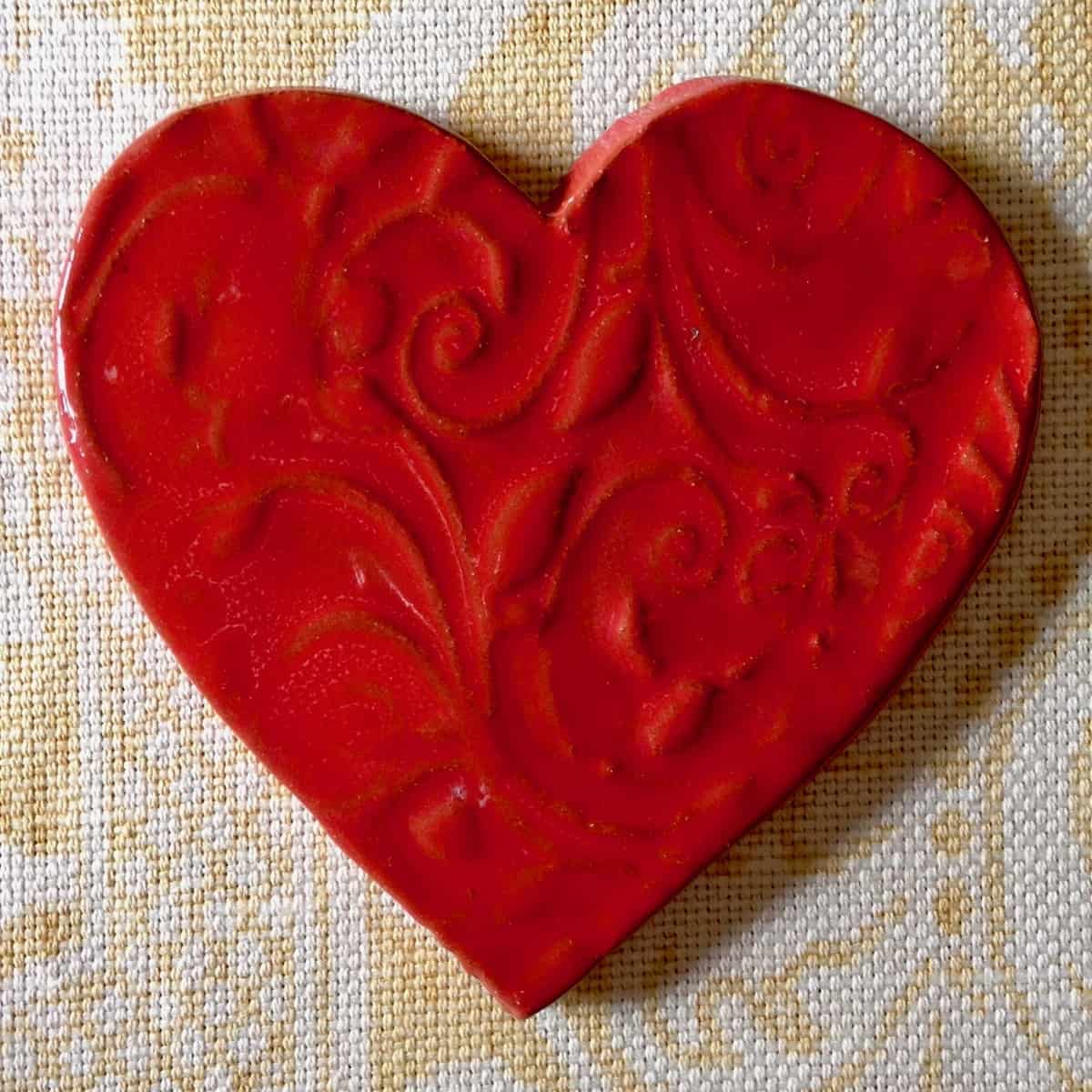 Red heart shaped pottery an act of kindness.