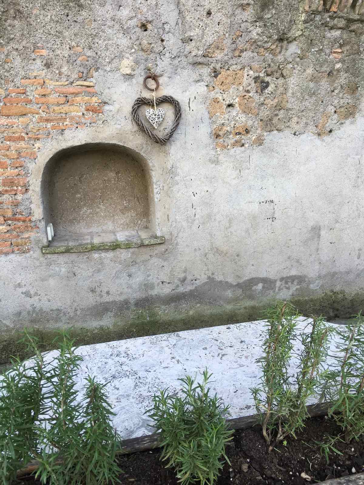 Heart decorations on an old Italian building.