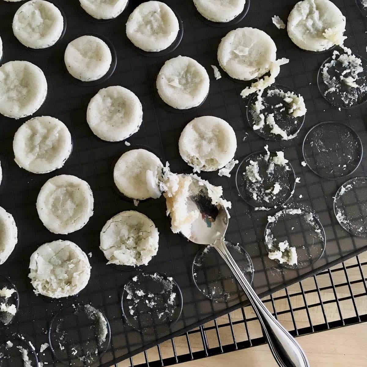 Not properly baked macarons sticking to pan.