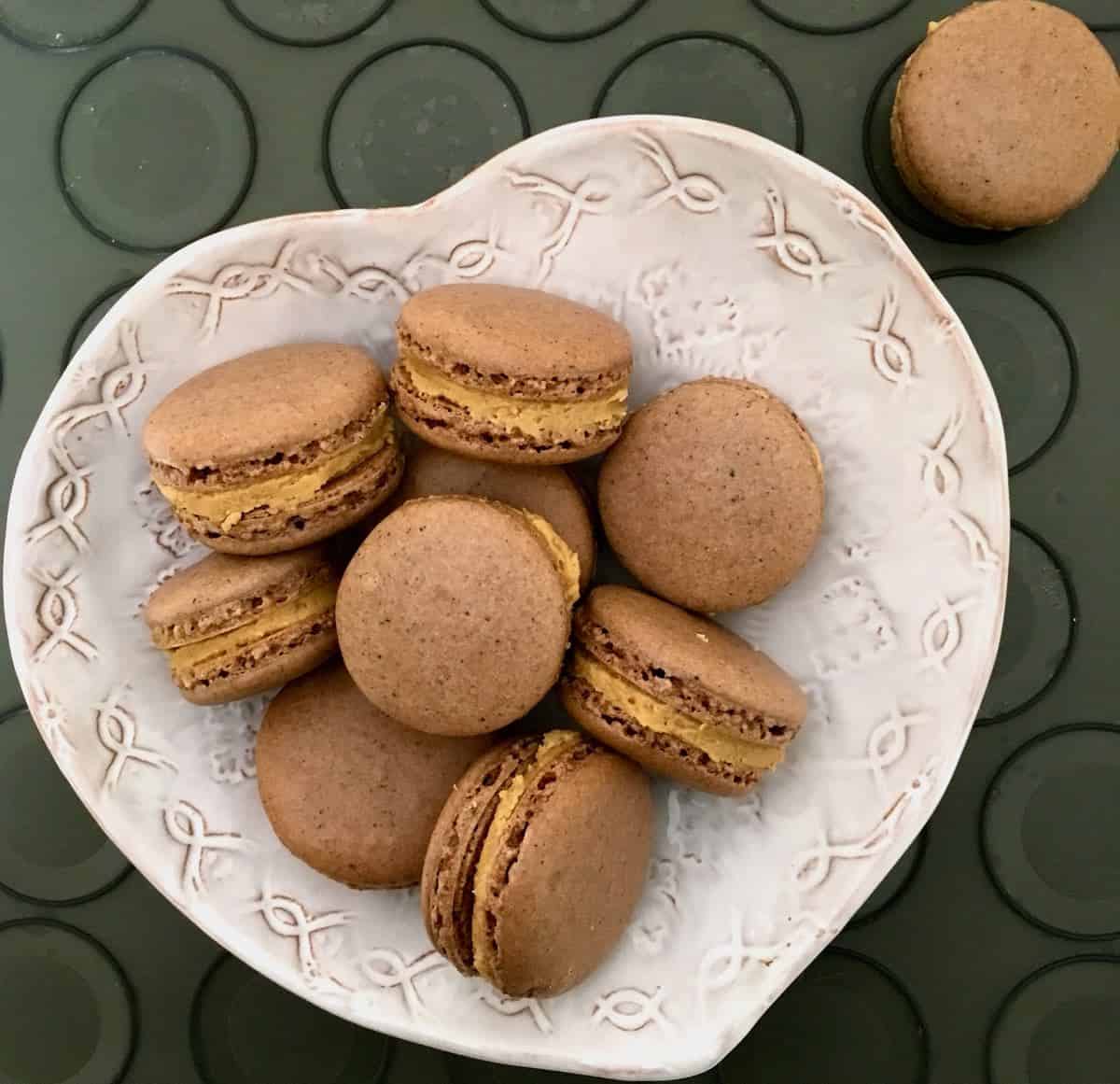 Peanut butter filled chocolate macarons.