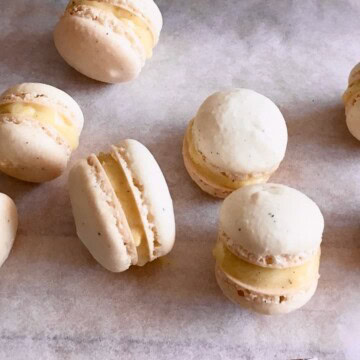 Baked and filled vanilla macarons.