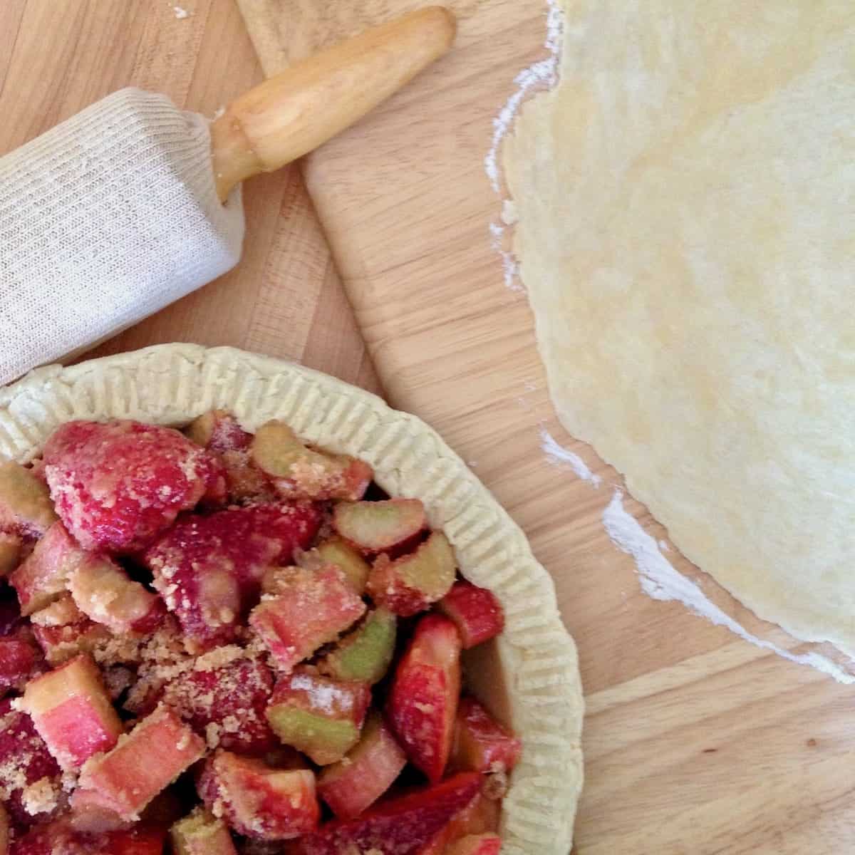 Rolling crust and filling pie.