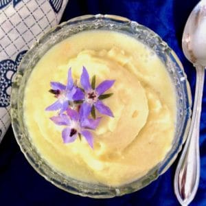 Cup of sorbet topped with borage flowers.