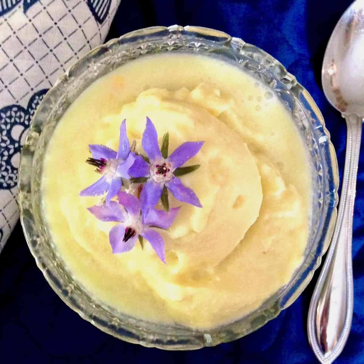 Cup of sorbet topped with borage flowers.