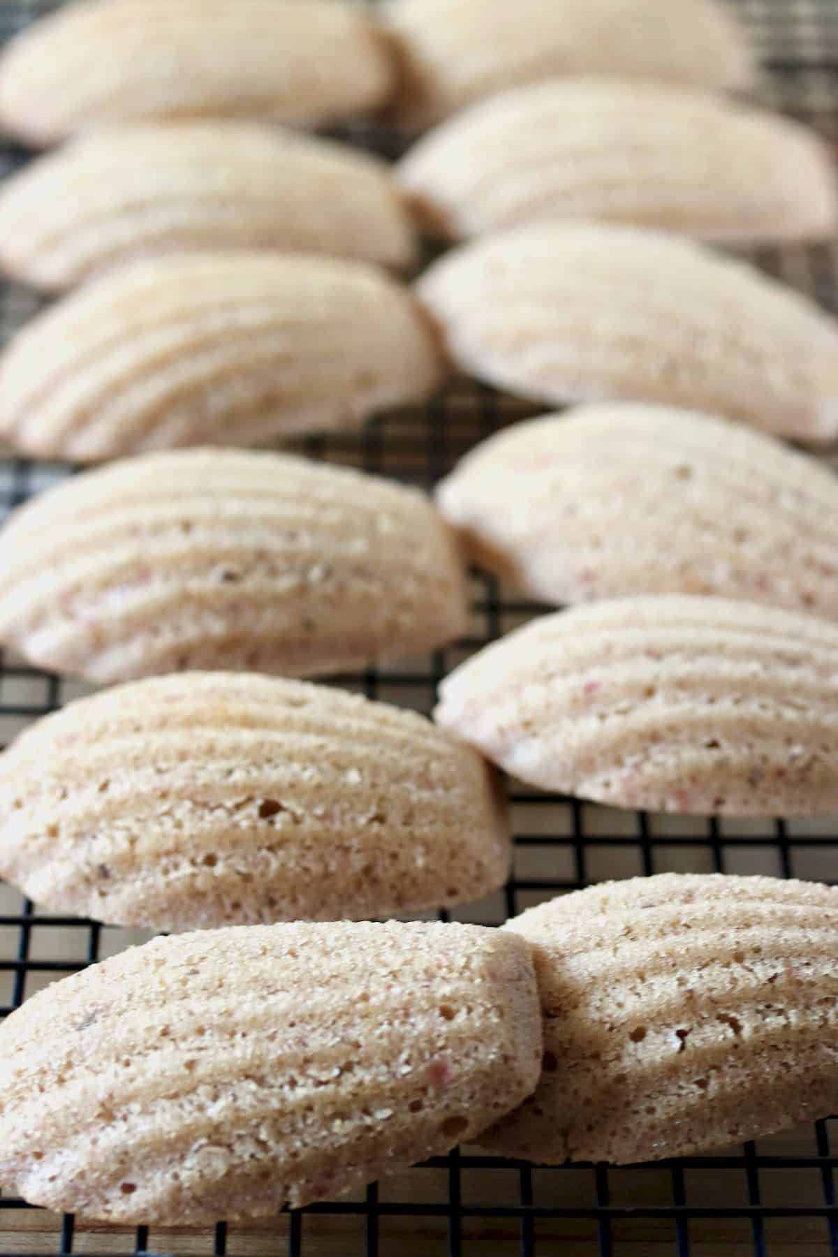 Thyme and strawberry madeleines on cooling rack.