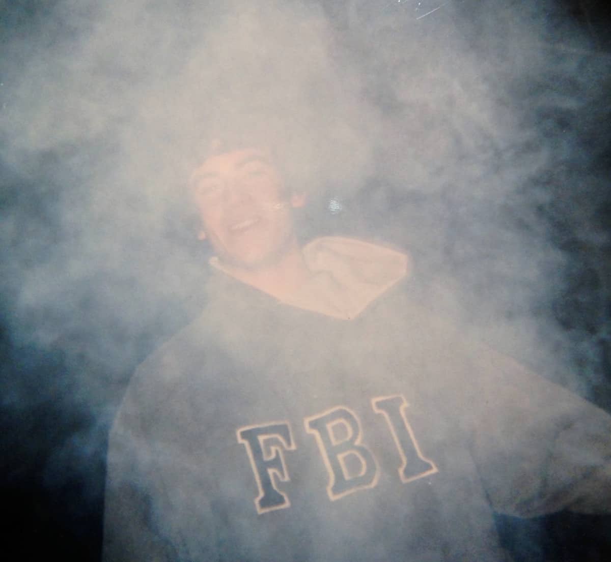 William surrounded by smoke.