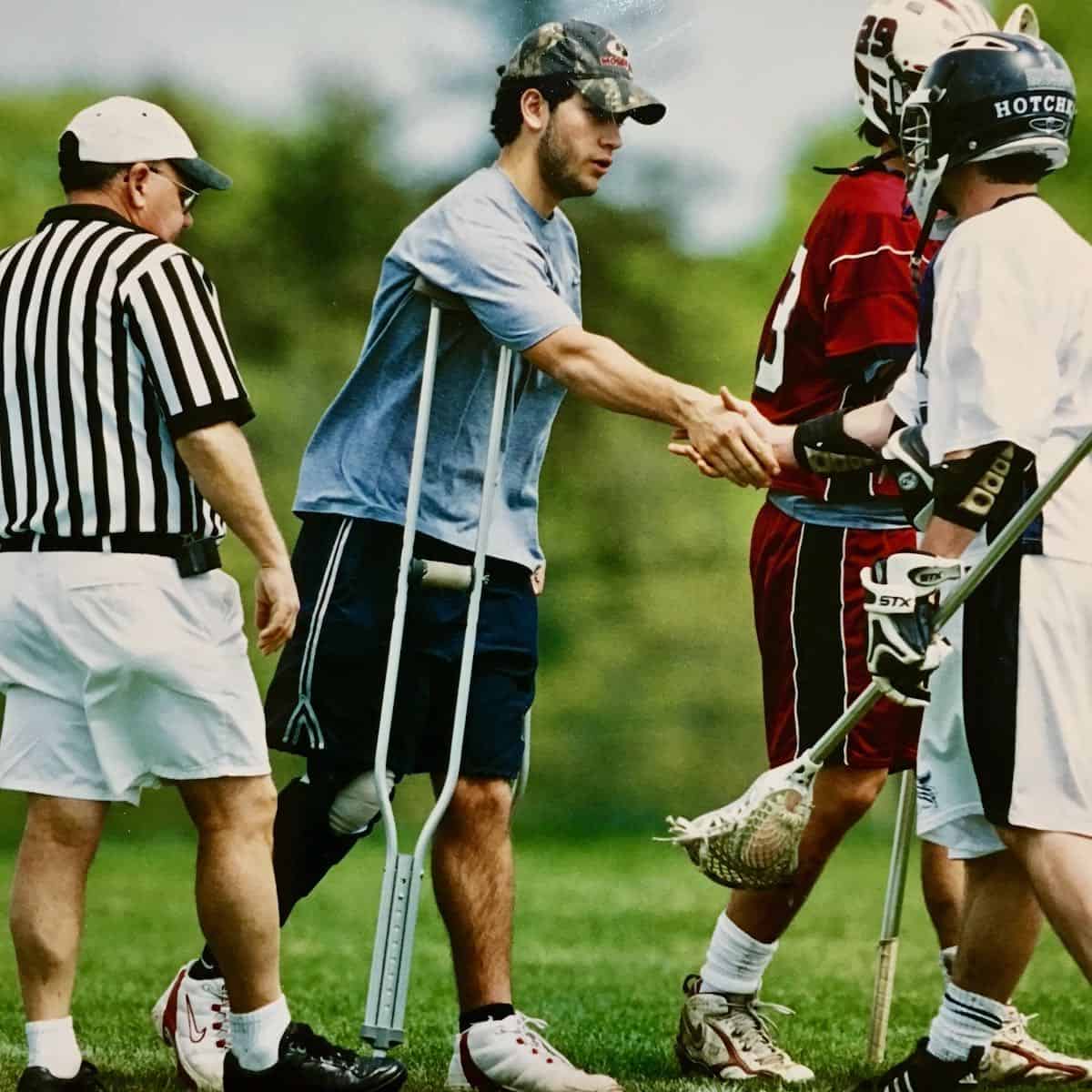My son post knee injury on lacrosse filed shaking hands with opposing team.