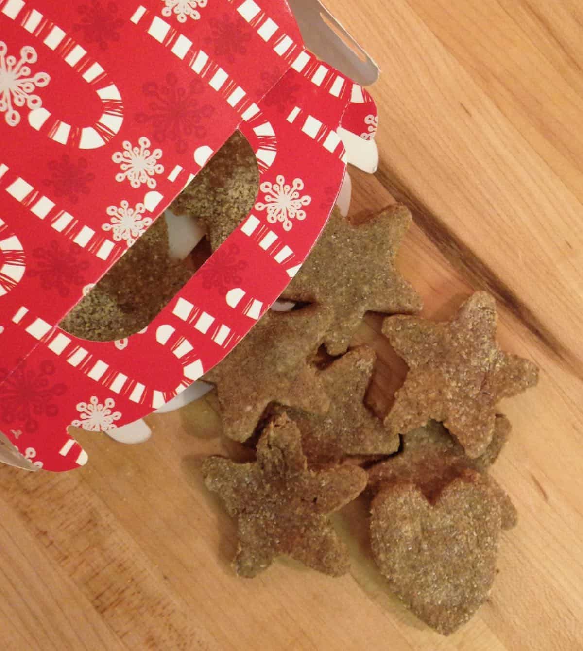 Grain-free dog biscuits shaped liked stars in a Christmas bag.