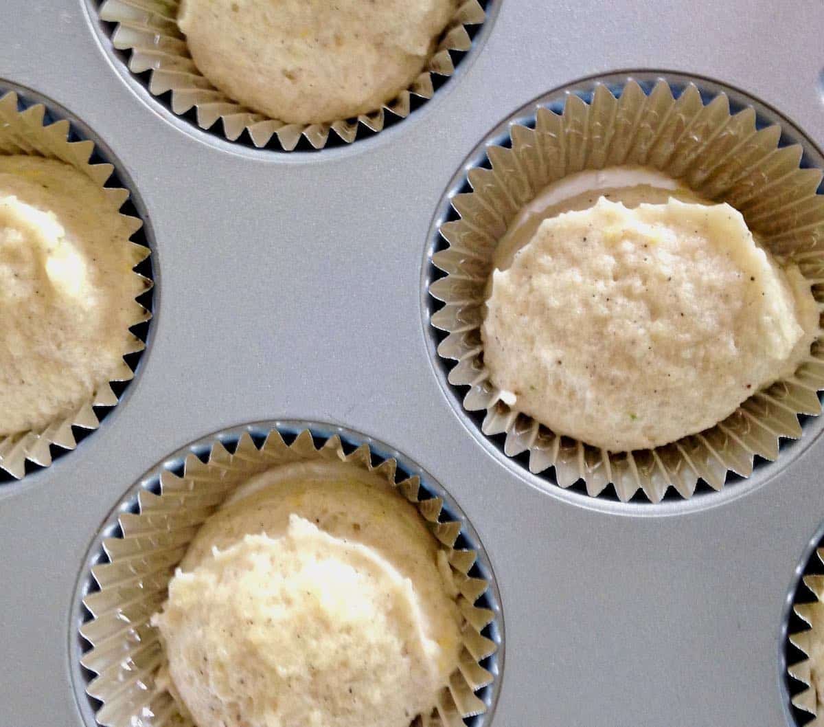 Baked with butter--see the difference in the batter?  Little blackberry almond cakes.