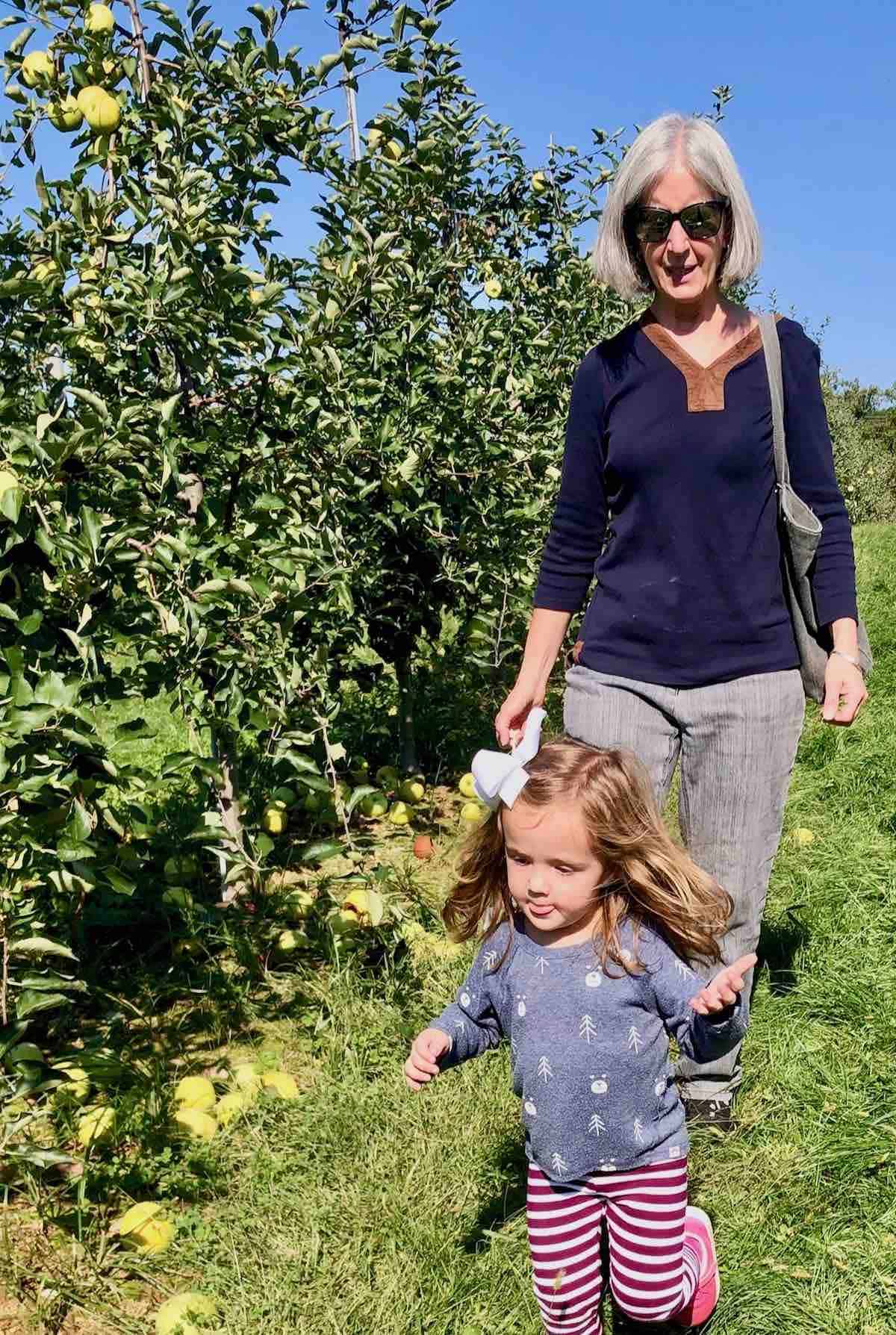 me and my grand daughter in apple orchard