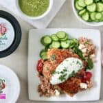 Amazing salsa salmon dinner includes cucumbers, bulgur salad and roasted salmon with salsa verde tzatziki.