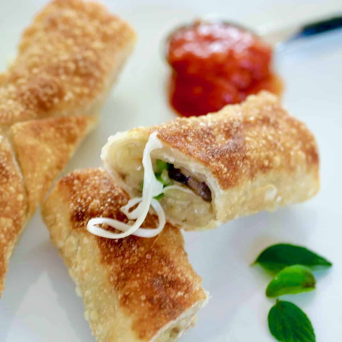 Egg rolls sliced in half.