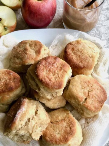 Easy Apple Butter Biscuits plated with apples and apple butter.