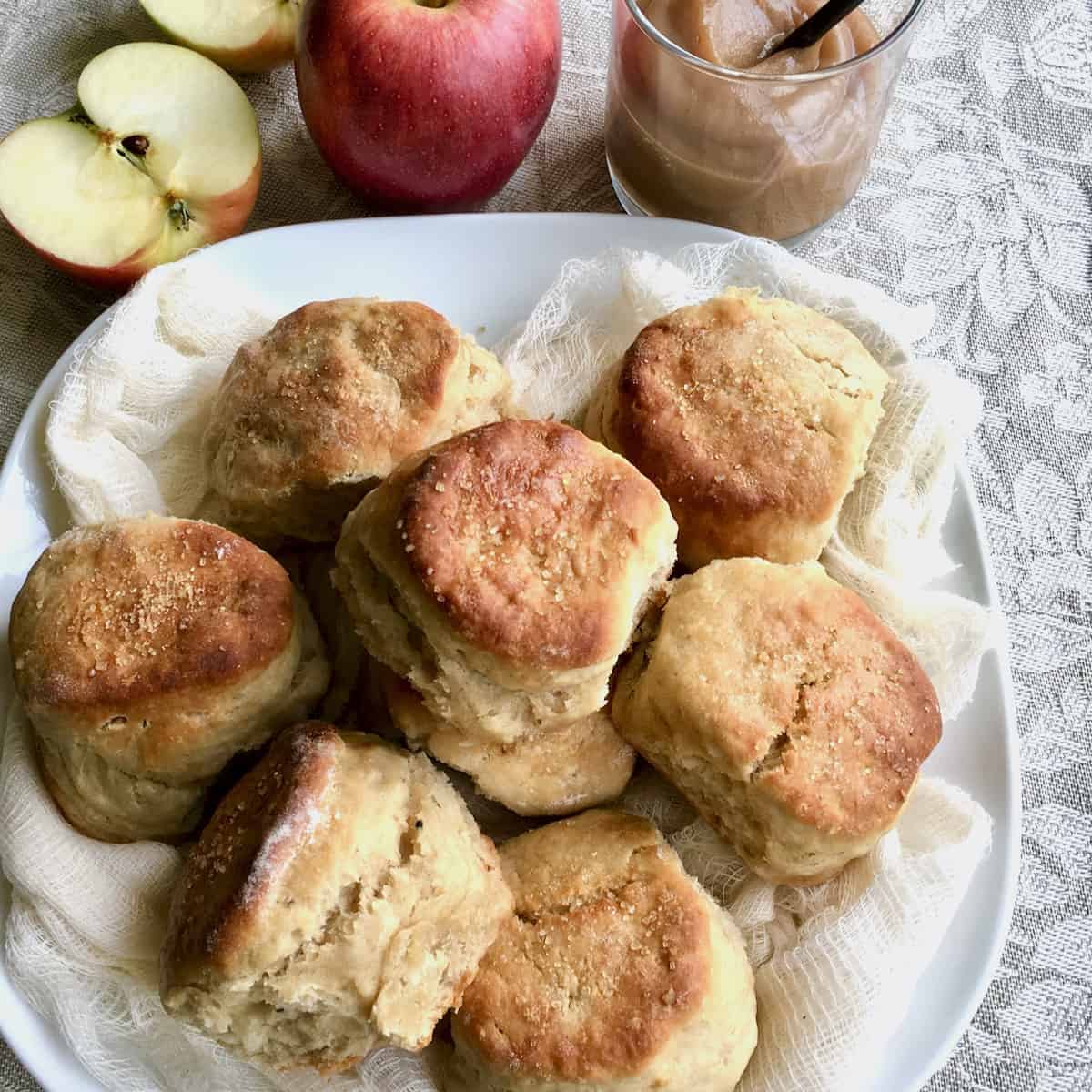 Easy Apple Butter Biscuits plated with apples and apple butter.