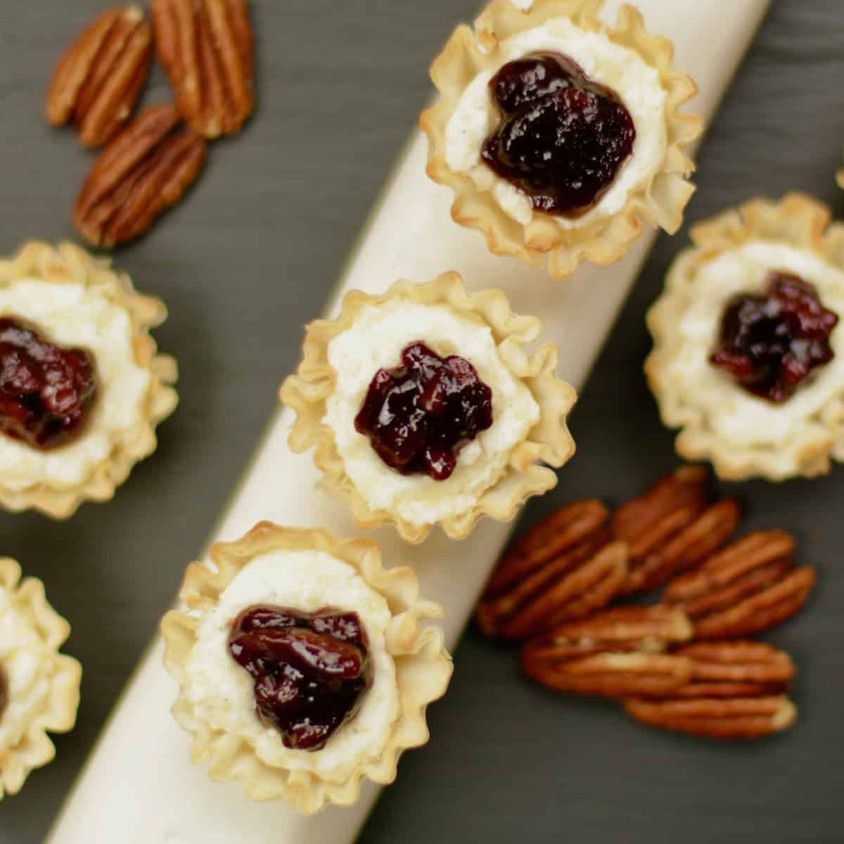 Phyllo cup cheese appetizer with pecan elderberry jam.
