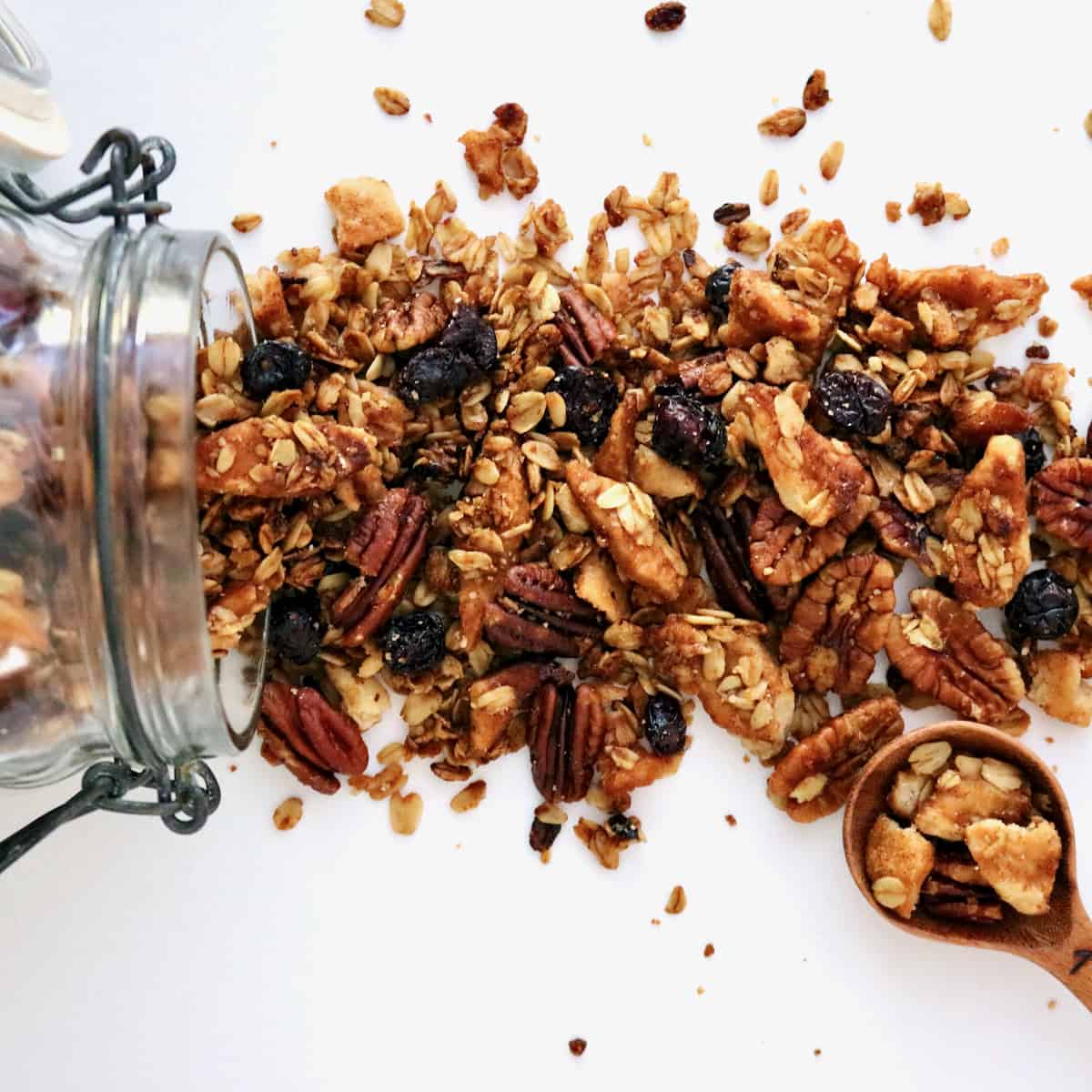 Pie crust granola spilling out of jar.