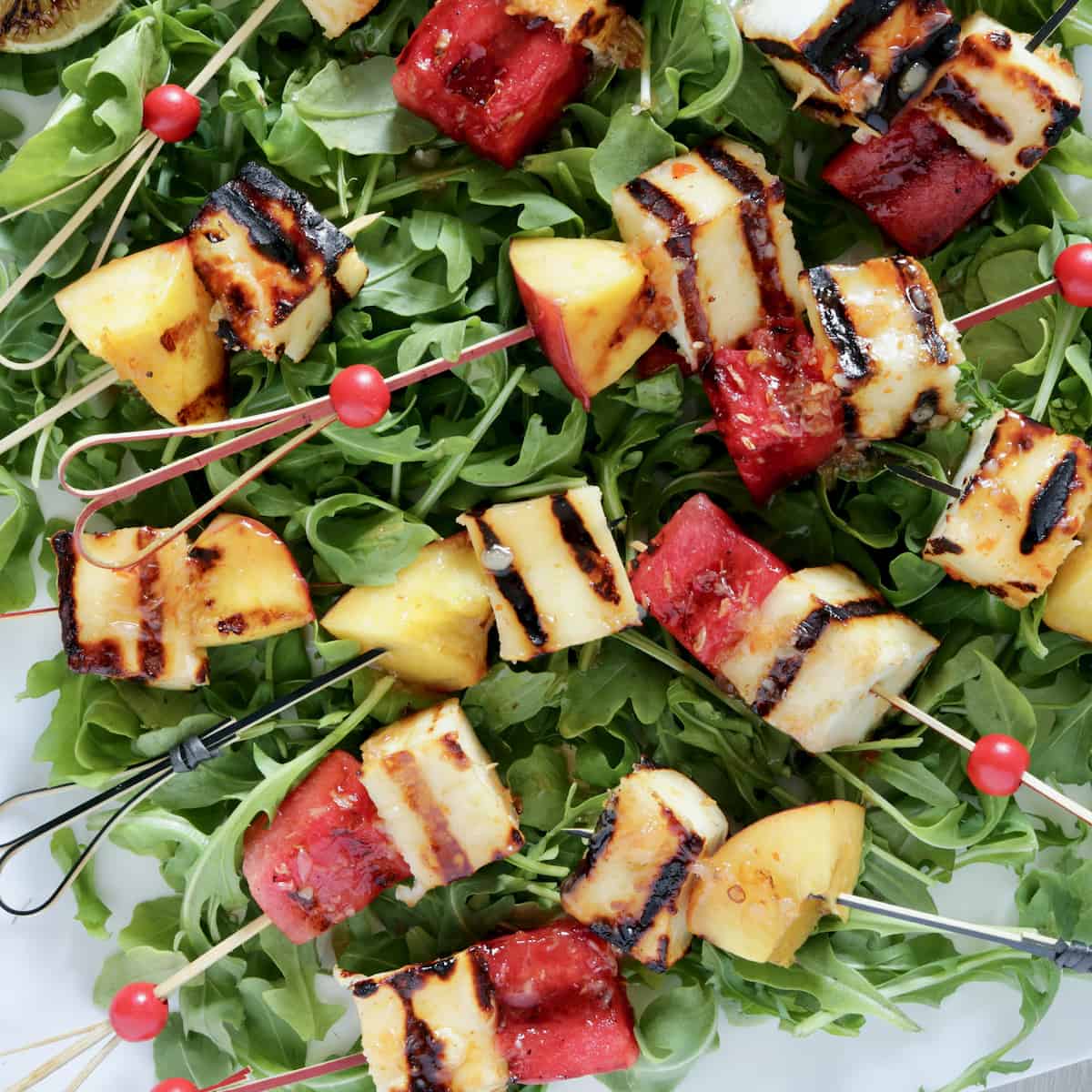 Grilled paneer and fruit skewers.