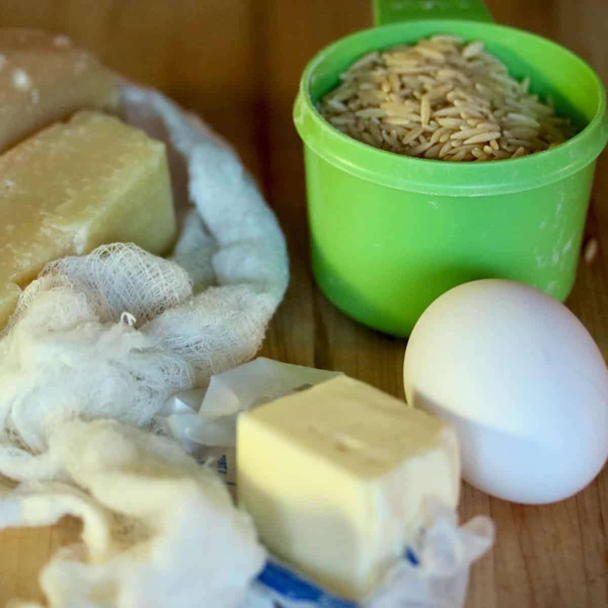 Pastina ingredients with cheese, eggs and butter.