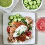 Amazing salsa salmon dinner includes cucumbers, bulgur salad and roasted salmon with salsa verde tzatziki.