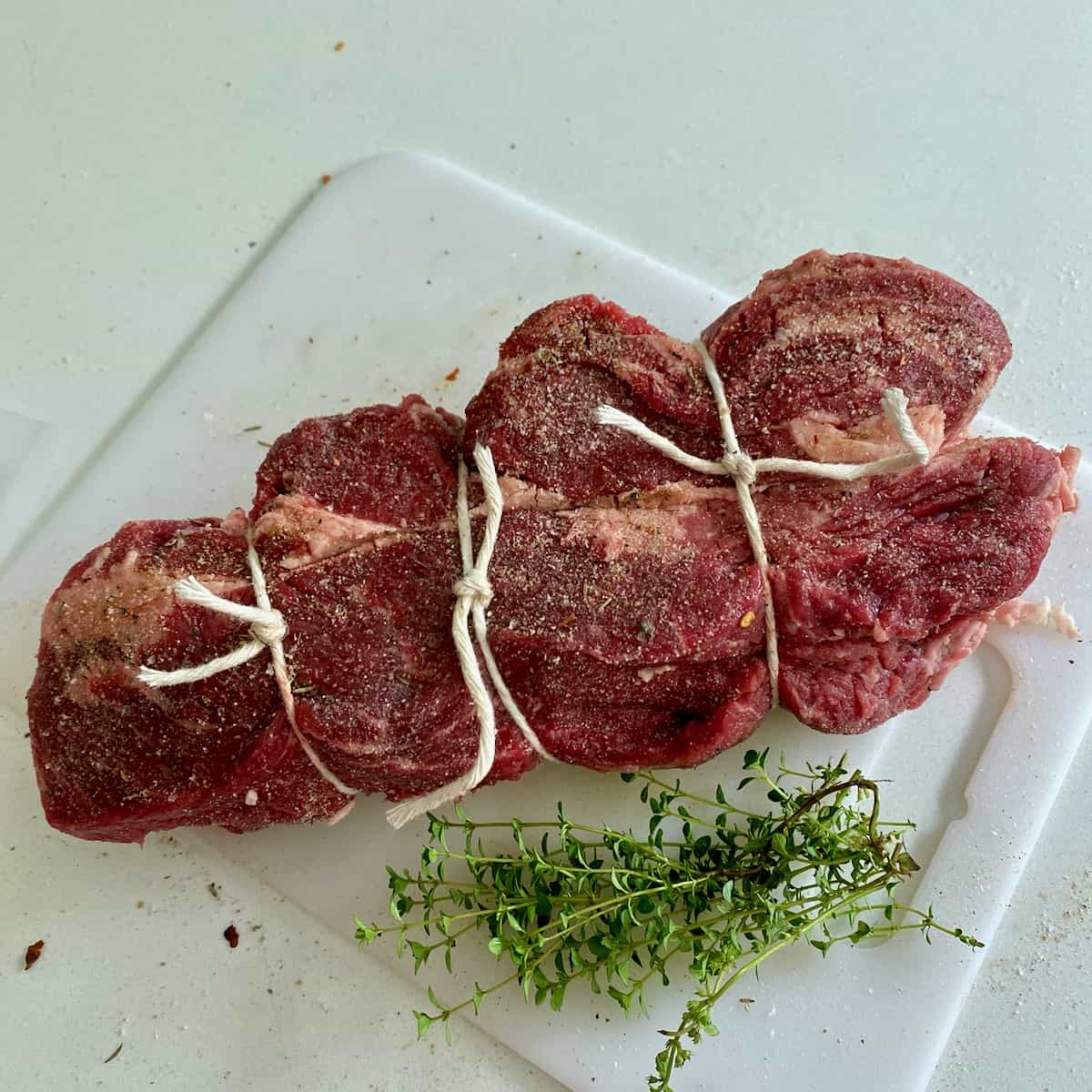 Preparing chuck roast for sous vide pot roast.