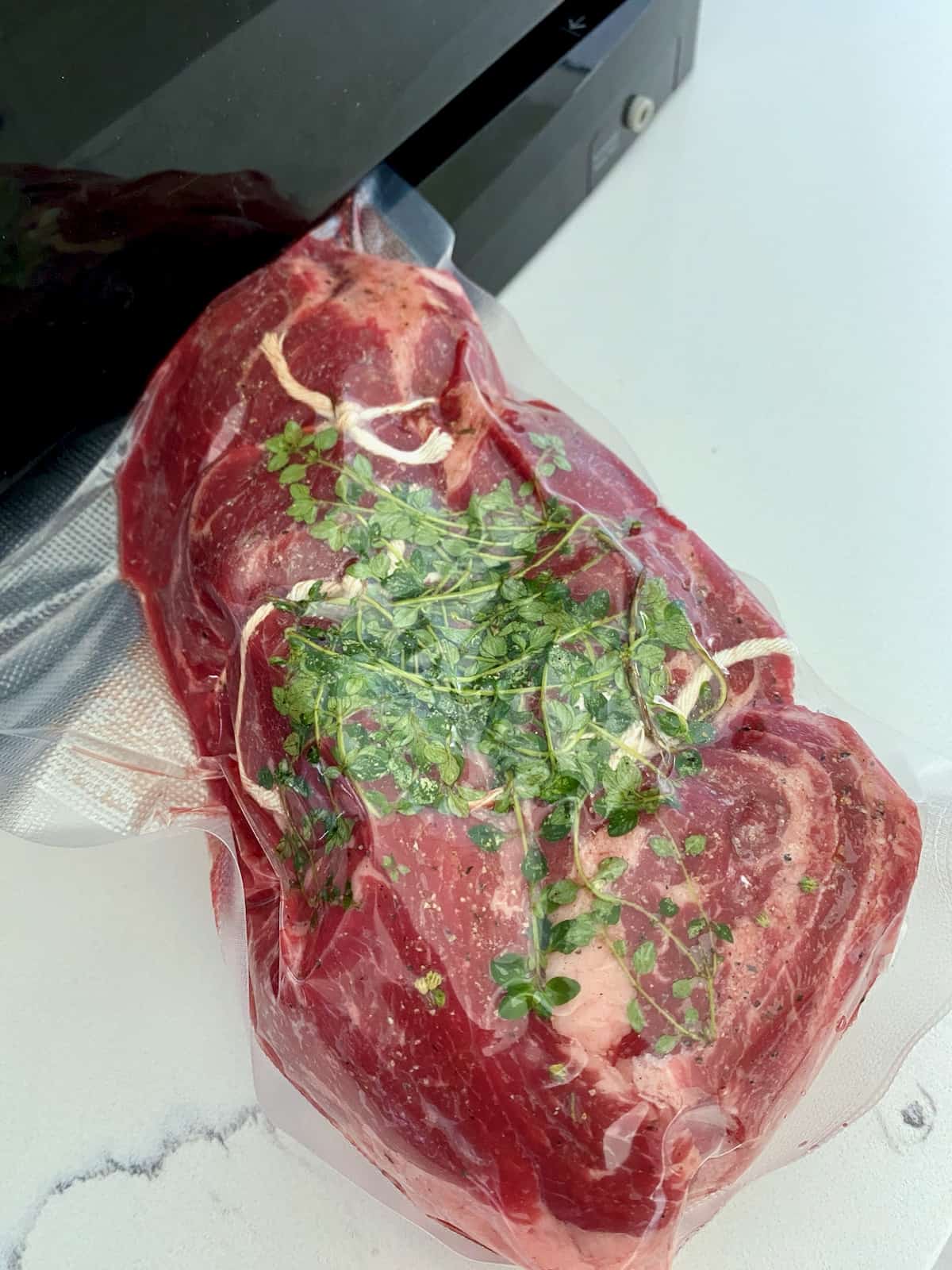 Vacuum sealed chuck roast with herbs.