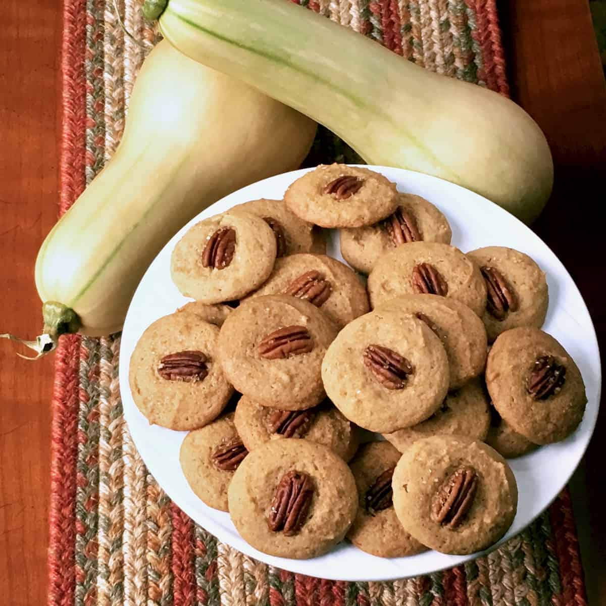 Plate of butternut pecan cookies and butternut squash.