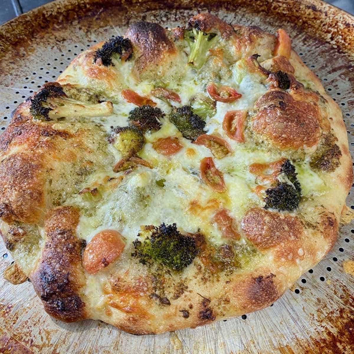 pizza with carrot tops basil pesto