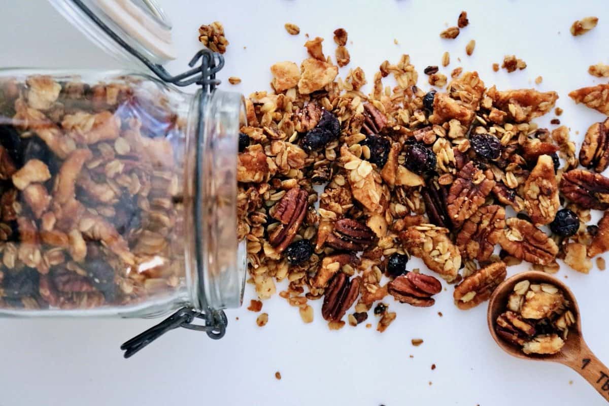 Pie crust granola spilling out of jar.